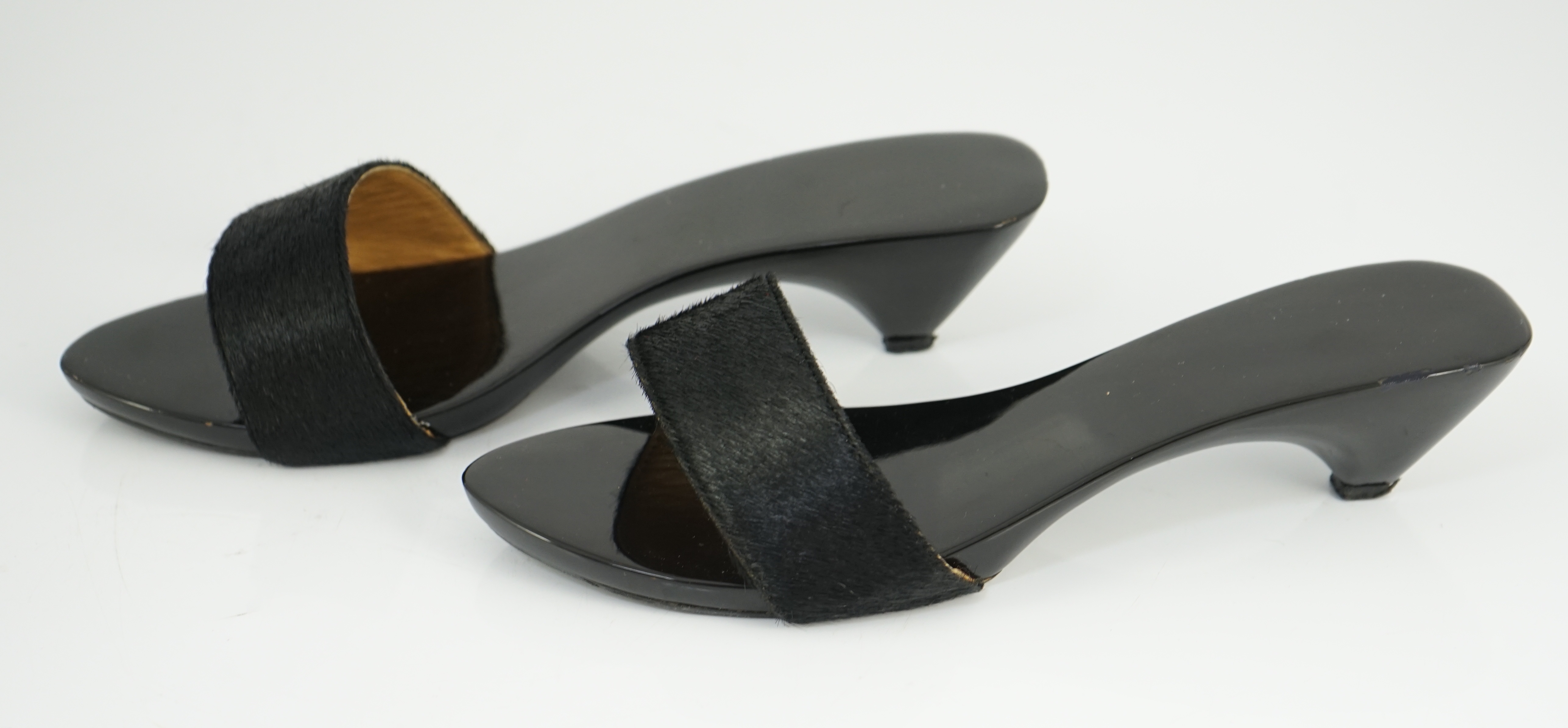 A pair of Hermès black pony skin and lacquer mules, Size 39
